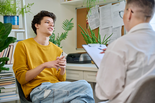 Teenager talking to a specialist